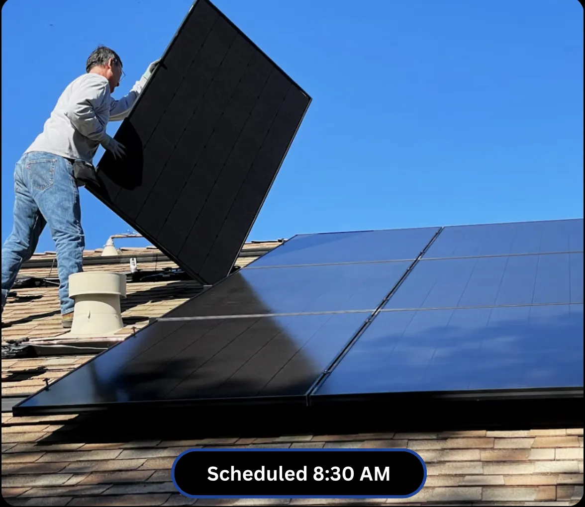 Solar panel installer working on a roof